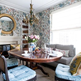 Traditional farmhouse dining room with floral wallpaper