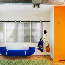 Santa Monica Loft, Entry Featuring Custom Window Screens and Pipe Bench by Dune