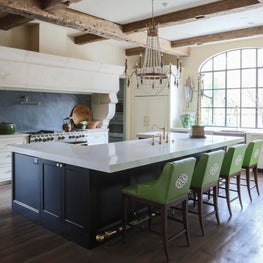 French transitional kitchen- steel windows, reclaimed beams & bright green twist