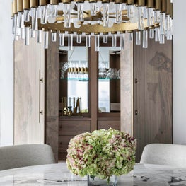 Portfolio: Neutral and sophisticated dining room with a custom table and gold chandelier
