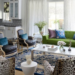 Art Deco living room, green sofa and leopard print chairs