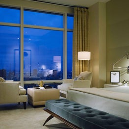 Master Bedroom in NYC apartment, city view, velvet cushion, bedroom seating 