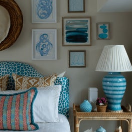 Wood tones and turquoise accents set the stage for this crisp guest bedroom