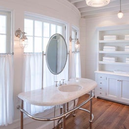 Custom chrome washstand with marble top and integrated mirror support, Seaside Avenue Residence