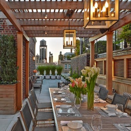 City terrace with alfresco dining and contemporary pergola