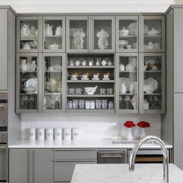 Kitchen cabinet highlighting over-the-top collection of Old Paris