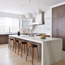Modern kitchen with waterfall island countertop