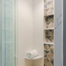 Master Bathroom with geometric tile details in shower
