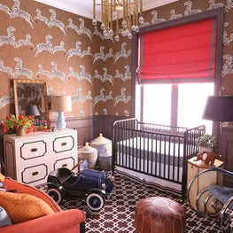 Kids room with zebra wallpaper & crib