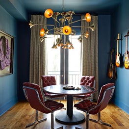 It’s all about rock n’ roll in this performer’s breakfast nook featuring music memorabilia, vintage furnishings, and an Italian trumpet chandelier.
