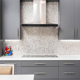 LAKEFRONT CONTEMPORARY VILLA, modern gray kitchen, stainless steel kitchen hood, gray modern cabinets