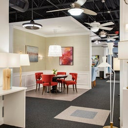 Lighting Showroom Design in Philadelphia Features Red Dining Chairs