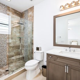 SLEEK CONTEMPORARY METALLIC RESIDENCE beige, taupe bathrrom. Taupe stained wood vanilty, beige tiled glass shower