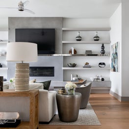 Portfolio: Modern living room with nature-inspired tones and Terrell James abstract art