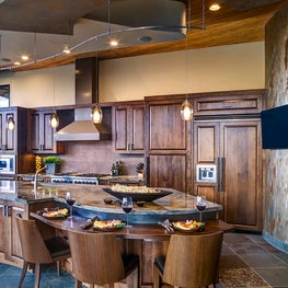 “Montana Tan” paint on the soffit is a warm, neutral tone that draws the eye toward the kitchen.