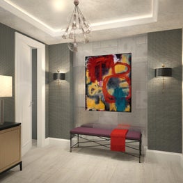 A modern abstract painting in primary colors stands out against a gray backdrop.