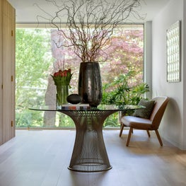 Mid century modern renovation entry hall with wood paneled wall