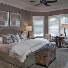 Tranquil serenity is achieved with a calming color palette for this bedroom.