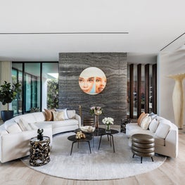 Welcome gallery featuring book matched onyx wall | Bal Harbor