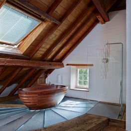 Swiss Chalet Master Bath with Freestanding Tub and Glass Shower Enclosure