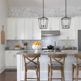 Kitchen detail of new island, tile range wall and new lighting 