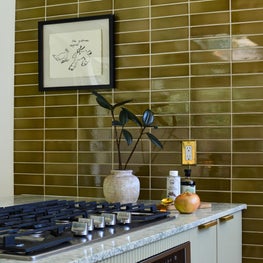 Eclectic Kitchen Design with Elongated Modern Gloss Ceramic Tile, Statement French Marble and a Lacquered Reeded Island