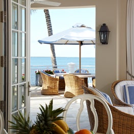 Indoor - outdoor living - perfect umbrella table for dining with an ocean view.