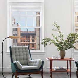 Living Room Seating by the Windows | Reupholstered Castro Convertibles Arden Chair + Niels Otto Moller Bar Cart