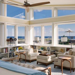 Master Bedroom in Hamptons Beach House with ocean views and seating for two.