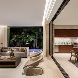 Family room and barbecue area blend seamlessly in this modern home | Bal Harbor