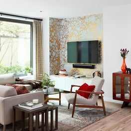 Manhattan Mid-Century living room with calico wallpaper and outdoor space