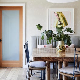 Sunny Dining room with Custom Burl Wood Table and Vintage French 1950s Chairs