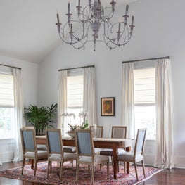 Traditional Dining Area with custom drapes and reupholstered seating 