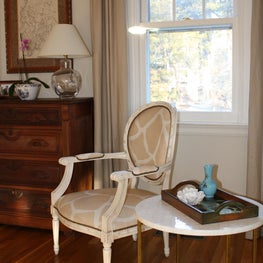 Printed hide giraffe patterned chair and antique chest of drawers