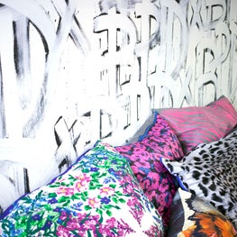 Custom Wallpaper Wall Application for a Denim Washhouse Showroom with Custom Silk & Leather Throw Pillows