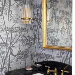 Powder room with custom marble top vanity and Cole and Son wall coverings