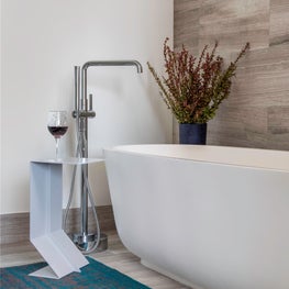 Portfolio: Sophisticated Bathroom with a Rustic Wall Covering and Dark Rug