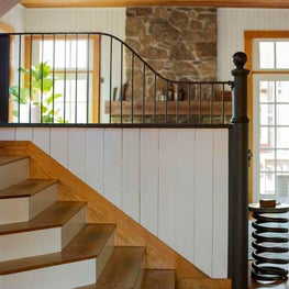 Open Plan Barn with Stone Fireplace and Shiplap Walls