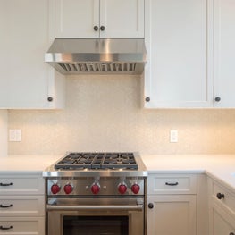 Open White Kitchen with Custom Cabinetry