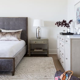 Portfolio: A master bedroom in Pebble Beach, CA featuring a light gray, Dion nightstand and a mist shagreen dresser.