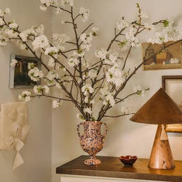 Vignette with Hand Painted Dresser, Copper Lamp and Blossoming Branches