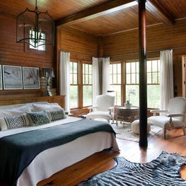 Country Barn Master Bedroom with Wood Beams and Lantern