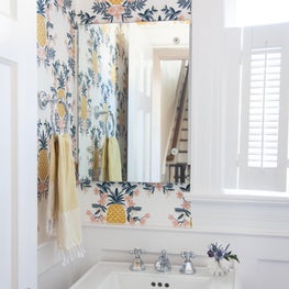 Powder Room - Yellow & Pink Pineapple Wallpaper. Pedestal Sink. Vintage Doorknob