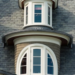 Curved Stacked Dormers With Lead Coated Copper on a Slate Roof