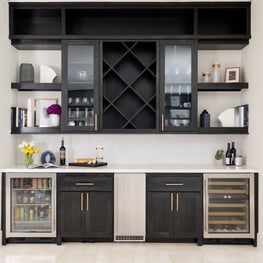 Portfolio: Dry bar area with ample storage, a mini fridge, plenty of counter space, and black stained cabinets