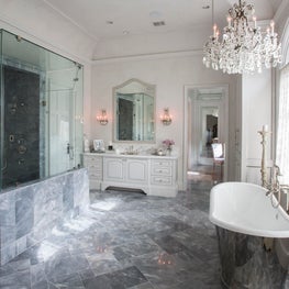 Luxurious master bath with a free standing tub & custom tile work