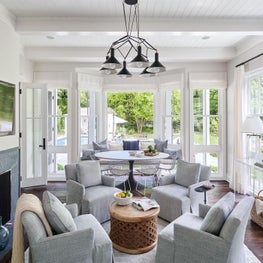Seating Area, Lee Industries Grey Armchairs, Built-in Sofa, Design Within Reach Metal Chairs, Tucker Robbins Round Coffee Table, Acrylic Floating Console, Fuse Overhead Lighting, West Elm Throws, - Coastal-Inspired Chicago Project