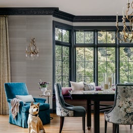 Craftsman transitional dining room with floral fabric, wallpaper, wall sconces