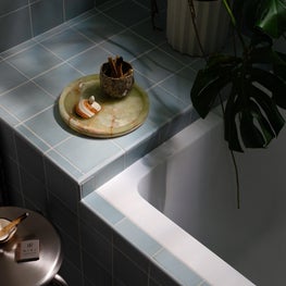 Integrated Bench Detail in Eclectic Bathroom with Matte Handmade Ceramic Tile