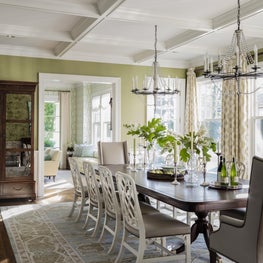 Dining room with chandeliers designed by Robin Gannon Interiors